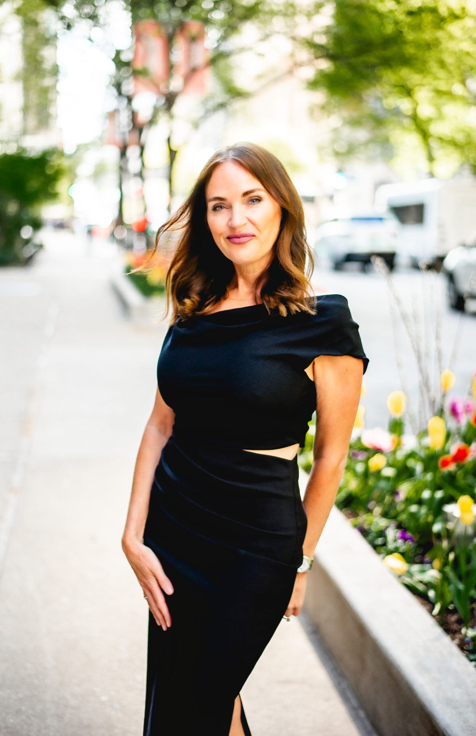 Erica Suzanne Matchmaker dressed in black dress smiling at the camera in Chicago.