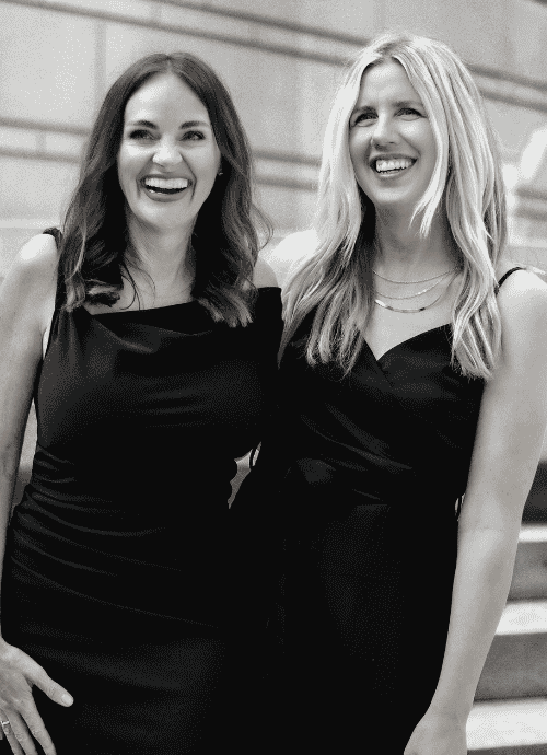 Black and white photo of Erica Suzanne Matchmaking and her VP & Senior Matchmaker, Katie at a team meeting in Minnesota